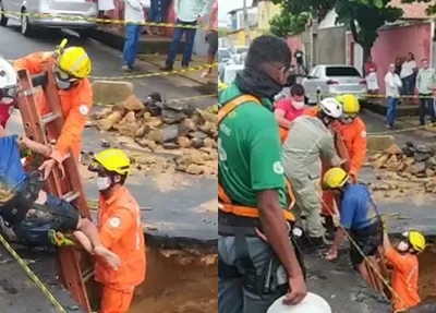 Homem sendo resgatado do buraco